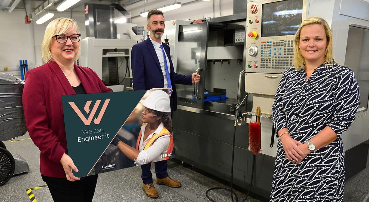 Female and male engineering lecturers pictured in engineering workshop.